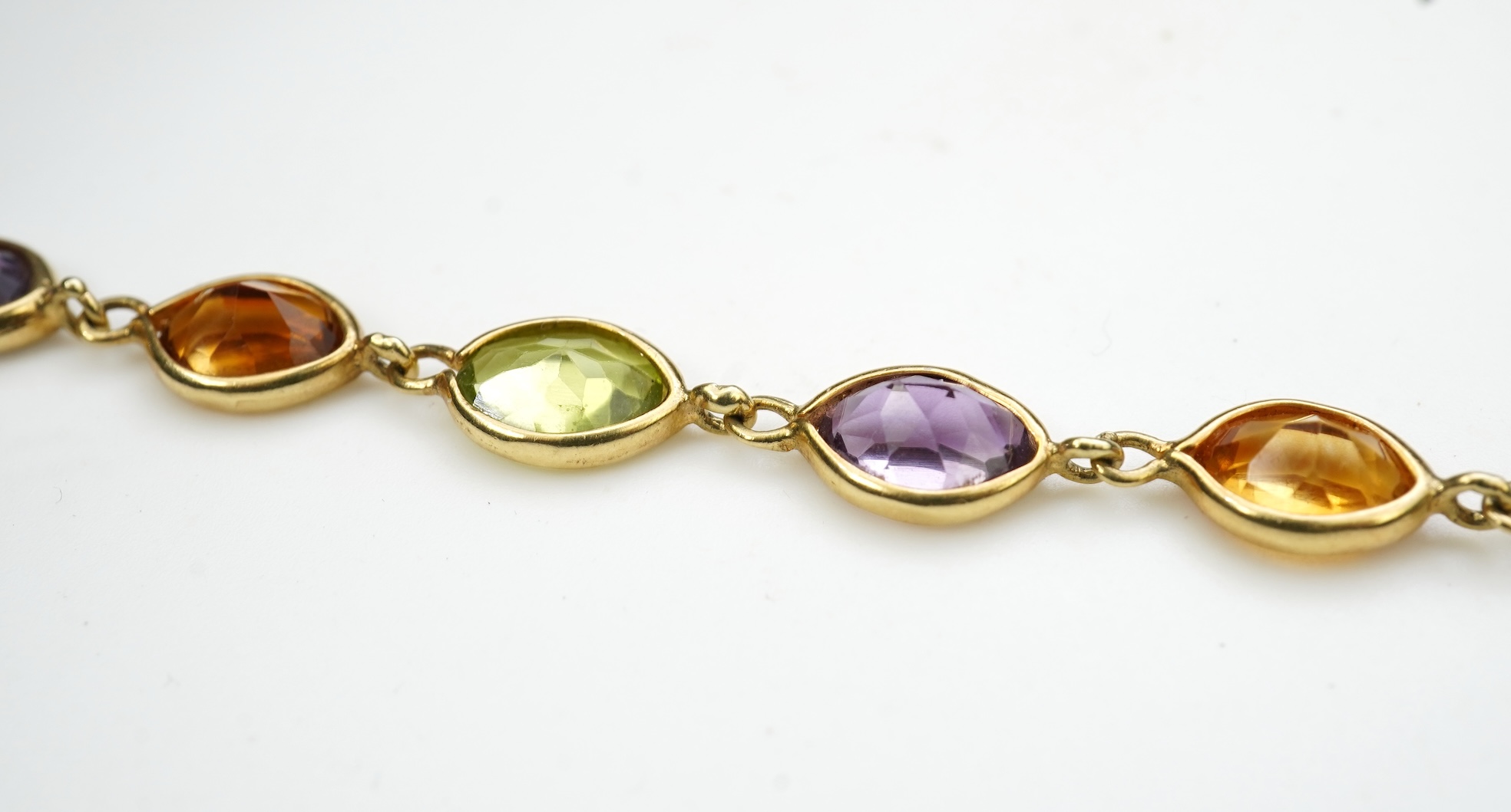 A gold and gem-set bracelet